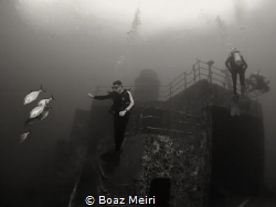 Divers at the Vandenberg shipwreck, Key West, FL. by Boaz Meiri 
